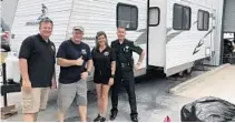  ?? COURTESY ?? Brian Donnelly, Tom O’Dea, Connie Berry, and Rick Ramsay stand in front of one of the donated trailers.