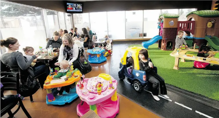  ?? PHOTOS: GREG SOUTHAM/ EDMONTON JOURNAL ?? Children play while mothers relax with food and coffee at Cafe O’Play, one of several local businesses that have gone beyond gourmet coffee to create community hubs for stay-at-home parents.