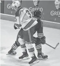  ?? JASON SIMMONDS/JOURNAL PIONEER ?? Summerside Western Capitals forward Isaac Wilson makes a nifty move around the South Shore Lumberjack­s’ Hunter Martin in the third period of Thursday night’s Maritime Junior Hockey League game at Eastlink Arena.