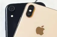  ??  ?? This photo shows the iPhone XR (left) that has a single lens, and the iPhone XS Max that has two lenses, in New York.