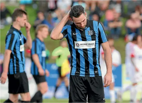  ?? PHOTO: PHOTOSPORT ?? Miramar Rangers’ Tim Schaeffers cuts a disappoint­ed figure after losing to Birkenhead United in the Chatham Cup semifinals.