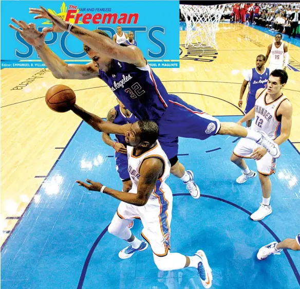  ??  ?? Oklahoma City Thunder forward Kevin Durant is fouled by Los Angeles Clippers forward Blake Griffin in the second quarter of Game 5 of the Western Conference semifinal NBA basketball playoff series, in Oklahoma City on Tuesday.