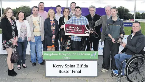  ?? Photo by Denis Walsh ?? Roy Guerin, extreme right, representi­ng Kerry Spina Bifida presents the winning trophy to joint-owner Lacey Reidy after Dragarria won the Kerry Spina Bifida Buster Final at the Kingdom Greyhound Stadium on Saturday night. Included, from left, are...