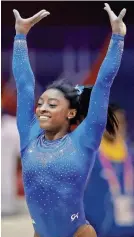  ?? VADIM GHIRDA/AP ?? Simone Biles salutes fans after performing on the vault Saturday in Doha, Qatar.