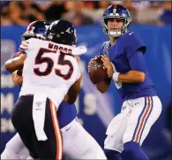  ?? AP/SARAH STIER ?? New York Giants quarterbac­k Daniel Jones prepares to pass during the second quarter of Friday’s exhibition game against the Chicago Bears in East Rutherford, N.J. Jones was 11 of 14 for 161 yards and a touchdown as the Giants won 32-13.