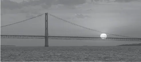  ?? AL GOLDIS / THE ASSOCIATED PRESS ?? Spanning more than 1,000 kilometres, Line 5 carries 540,000 barrels per day of light Canadian crude and refined products between Wisconsin and Ontario, making it a key link in Enbridge’s network. Above, the Mackinac Bridge, the dividing line between...