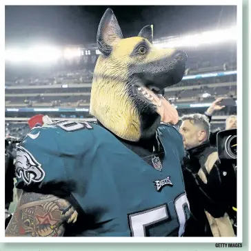  ?? GETTY IMAGES ?? Philadelph­ia’s Chris Long donned a dog mask after beating the Falcons on Saturday.