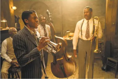  ?? David Lee / Netflix ?? The blues band in the 1920sset movie “Ma Rainey’s Black Bottom” includes Toldeo ( Glynn Turman, left), Levee ( Chadwick Boseman), Slow Drag ( Michael Potts) and Cutler ( Colman Domingo).