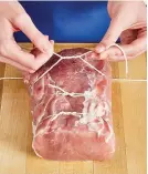  ??  ?? For even cooking, fold narrow end of pork in, then evenly truss the roast with kitchen string.