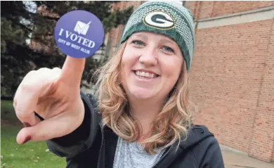  ?? MIKE DE SISTI / MILWAUKEE JOURNAL SENTINEL ?? Alisha Nelson of West Allis, proudly holds her “I Voted” sticker Tuesday as Americans cast their votes in the midterm election.