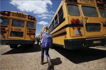  ?? ROGELIO V. SOLIS — THE ASSOCIATED PRESS FILE ?? In this file photo, a student prepares to leave the Enterprise Attendance Center, southeast of Brookhaven, Miss.