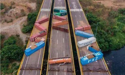  ??  ?? Tthe Tienditas bridge, which links Venezuela and Colombia, was blocked off with containers earlier this month. Photograph: Juan Pablo Bayona/AFP/Getty Images