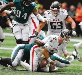  ?? CURTIS COMPTON/CURTIS.COMPTON@AJC.COM ?? Philadelph­ia’s Javon Hargrave sacks Matt Ryan late Sunday, as Ryan described Atlanta getting into too many known passing situations.