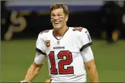  ??  ?? Quarterbac­k Tom Brady has agreed to a contract extension with the Buccaneers that provides the Super Bowl champions with much-needed salary cap relief.