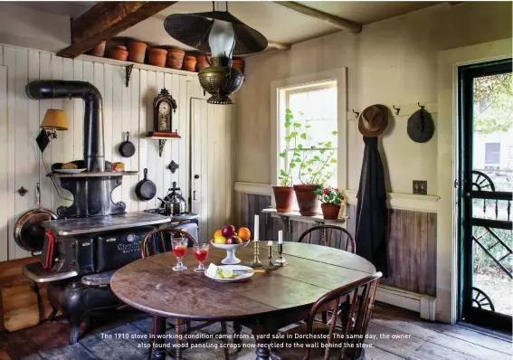  ??  ?? The 1910 stove in working condition came from a yard sale in Dorchester. The same day, the owner also found wood paneling scraps now recycled to the wall behind the stove.