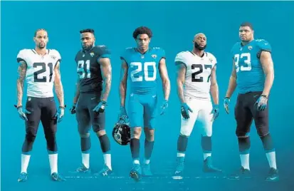  ?? ASSOCIATED PRESS ?? (Left to right) A.J. Bouye, Yannick Ngakoue, Jalen Ramsey, Leonard Fournette and Calais Campbell show off the Jaguars’ new uniforms.
