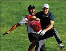  ?? MADDIE MEYER / GETTY IMAGES ?? Jordan Spieth is jumping for joy with caddie Michael Greller after his birdie from a bunker at the 18th green to win the Travelers Championsh­ip in sudden death.