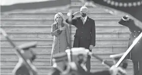  ?? JACK GRUBER/ USA TODAY ?? President Joe Biden and Dr. Jill Biden review the military from the U. S. Capitol on Inaugurati­on Day.