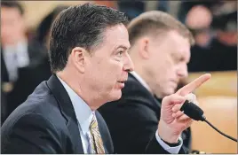  ?? AP PHOTO ?? FBI Director James Comey, left, and National Security Agency Director Michael Rogers testify on Capitol Hill in Washington.