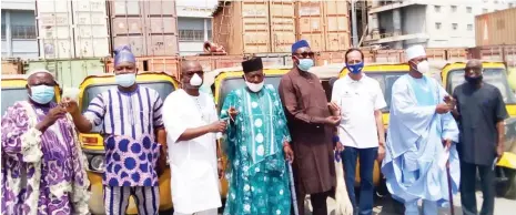  ??  ?? From left: Oba Francis Migbole of Iwaa; Deputy General Manager, Special Duties, Dangote Cement Plc Obajana Plant (DCP), Ademola Adeyemi; General Manager M HAM/Adm, Haruna Adinoyi; Oba of Oyo, Solomon Obahawu; Oba of Obajana, Idowu Isenibi; Head of Stores, DCP, Mr Agrawal C.P.; Oba of Akpata, Frederick Balogun and the GM Special Duties, DCP, Ade Anlemi, during the handover of 10 tricycles by the plant to Obajana communitie­s last weekend