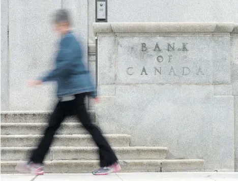  ?? ADRIAN WYLD/THE CANADIAN PRESS FILES ?? Canada’s big banks are warning against overplayin­g concerns about the country’s record debt levels. They say the economy won’t be derailed for numerous reasons, including the view the Bank of Canada won’t hike rates if signs of stress emerge.