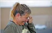  ?? ANDRES LEIGHTON/ASSOCIATED PRESS ?? Edie Hallberg cries while speaking to police outside the El Paso Walmart where 20 were killed. She was searching for her missing mother, Angie Englisbee. Englisbee, who was born and raised in Santa Fe, was slain in the attack.