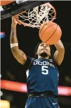  ?? NICK WASS/AP ?? Uconn guard Stephon Castle dunks during the first half against Georgetown on Saturday in Washington.