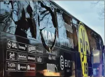  ?? MARTIN MEISSNER / ASSOCIATED PRESS ?? A window of the Borussia Dortmund soccer team’s bus is damaged after an explosion April 11. The suspect made “suspicious options purchases” for shares in the team the same day as the attack, officials said.