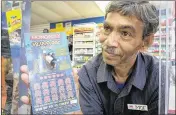  ?? ALLEN EYESTONE / THE PALM BEACH POST ?? Moe Hoq sold a winning $2 million scratch-off ticket on Saturday at the Marathon Gas Station on Broadway in Riviera Beach.