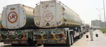  ??  ?? Thawing of frozen ties: Trucks carrying oil supplies for Nato forces in Afghanista­n, parked at a compound in Karachi, Pakistan, on Friday. Recent days have seen prospects for Pakistani-us relations on the rise again. — EPA