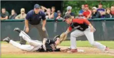  ?? KYLE FRANKO — TRENTONIAN PHOTO ?? Somerville’s Devin Hack, left, dives safely back to the base before Allentown first baseman Brandon Gaul, right, can put the tag down during the Group III state final at Veterans Park on Sunday.