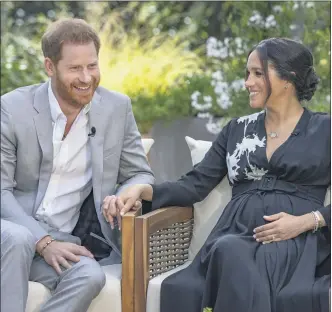  ?? JOE PUGLIESE — HARPO PRODUCTION­S VIA AP ?? This image provided by Harpo Production­s shows Prince Harry, left, and Meghan, Duchess of Sussex, speaking about expecting their second child during an interview with Oprah Winfrey. “Oprah with Meghan and Harry: A CBS Primetime Special” aired March 7as a two-hour exclusive primetime special on the CBS Television Network.