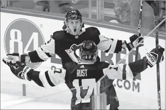  ?? [GENE J. PUSKAR/THE ASSOCIATED PRESS] ?? Pittsburgh’s Carl Hagelin, rear, celebrates his goal during Saturday’s game against Toronto.