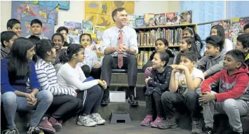  ?? CHRIS YOUNG/ THE CANADIAN PRESS ?? Federal Finance Minister Bill Morneau spoke with students from Toronto’s Rose Avenue Junior Public School before a pre- budget photo opportunit­y in Toronto on Friday.