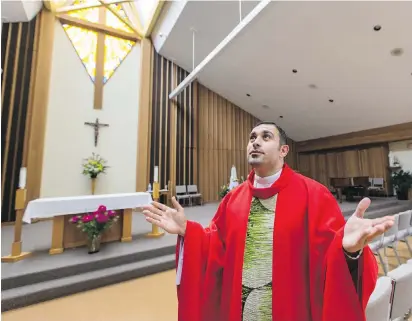  ??  ?? Father Karam Alraban, at Holy Cross Catholic Church in Gordon Head, where he shares his stories ahead of World Refugee Day, which is on Tuesday. Alraban was granted refugee status in Canada in 2014 after fleeing Iraq, where his life was threatened and...