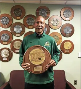  ??  ?? William Dockery holds the NJCAA Division II Region XX trophy after Cecil College defeated Chesapeake College to earn a berth in the national tournament. Dockery is a Trenton native who graduated from the Pennington School. (Courtesy of William Dockery)