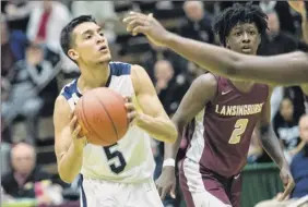  ?? Jim Franco / Special to the Times Union ?? Mekeel Christian Academy’s Ozzy Dejesus, who finished with 21 points, six rebounds and six assists, looks to shoot vs. Lansingbur­gh on Sunday.