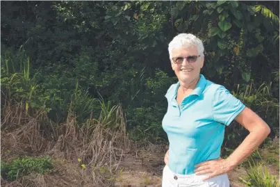  ?? PERFECT PLOT: Truus Biddlecomb­e on the edge of rainforest she says would be ideal for a “green cemetery”. ??