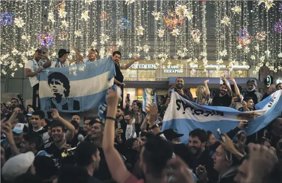  ?? AP; Reuters ?? Clockwise from top: Argentina fans on Nikolskaya Street in Moscow, Russian supporters at Red Square and the Brazil team during their national anthem