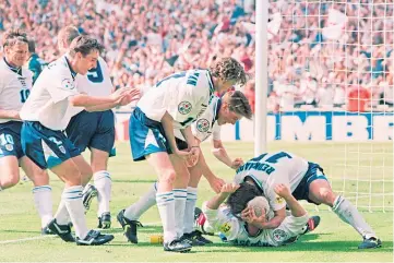  ??  ?? Paul Gascoigne and England team-mates hit the Wembley turf after the then Rangers midfielder scored the second goal in the 2-0 win over Scotland.