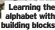  ?? ?? Learning the alphabet with building blocks