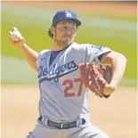  ?? JEFF CHIU ASSOCIATED PRESS FILE PHOTO ?? A report says MLB is looking into balls Dodgers pitcher Trevor Bauer threw against the Athletics on Wednesday in Oakland. Unnamed sources said the balls were sticky and had visible markings on them.