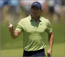  ?? AP ?? Rory Mcilroy waves after making a putt on the first hole during the first round of the PGA Championsh­ip on Thursday in Tulsa, Okla.