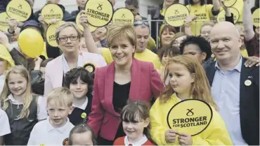  ??  ?? 0 Nicola Sturgeon, campaignin­g with candidate Joanna Cherry in Edinburgh South West yesterday