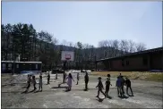  ?? MATT SLOCUM - THE ASSOCIATED PRESS ?? Students play outside during recess at the Panther Valley Elementary School, Thursday, March 11, 2021, in Nesquehoni­ng, Pa. On May 26, 2020, former student, 9-year-old Ava Lerario; her mother, Ashley Belson, and Ava’s father, Marc Lerario, were found fatally shot inside their home.
