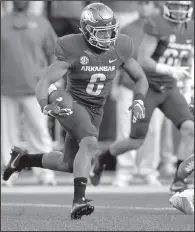  ?? NWA Democrat-Gazette file photo ?? Arkansas sophomore T.J. Hammonds is expected to miss the remainder of fall camp after suffering a knee injury Tuesday. Hammonds was off to a good start in camp, according to offensive coordinato­r Dan Enos and position coaches Michael Smith and Reggie...