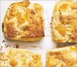  ?? PHOTOS BY YOSSY AREFI/NEW YORK TIMES ?? From top: Sour cream and fruit scones, peanut butter raspberry bars and berry buttermilk cake all are ideal to be made with frozen fruit.