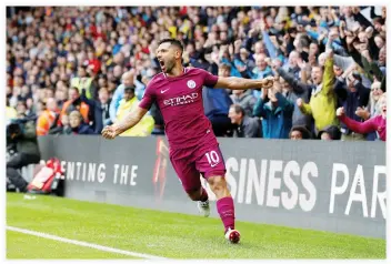  ??  ?? Manchester City’s Sergio Aguero celebrates after scoring their fifth goal completing his hat trick against Watford on Saturday. (Reuters)