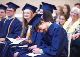  ?? NWA Democrat-Gazette/CHARLIE KAIJO ?? Classical Academy graduate Houston White laughs as teacher Bruce Horswell shares personal stories during a graduation ceremony Sunday at Avondale Chapel and Gardens in Bentonvill­e. Northwest Arkansas Classical Academy, a charter school that opened in...