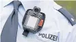  ?? FOTO: DPA ?? Solche Bodycams mit Display sollen die Polizisten schützen.